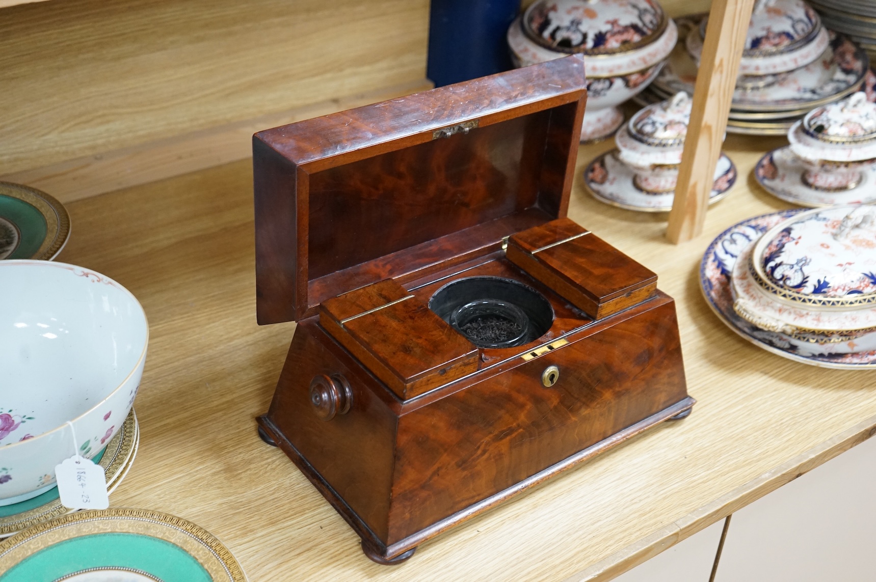 An early Victorian mahogany sarcophagus shaped tea caddy, 35cm wide